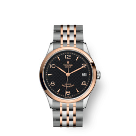 MONTRE TUDOR 1926 CADRAN NOIR LUNETTE OR ROSE