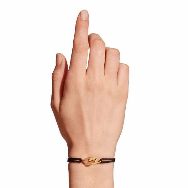 Bracelet Dinh Van Menottes R10Or Jaune sur cordon