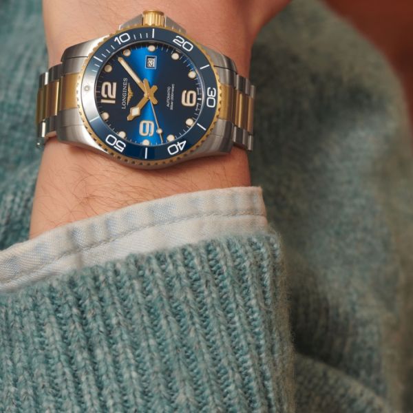 Montre Hydroconquest Cadran Bleu soleillé Bracelet Acier et PVD jaune