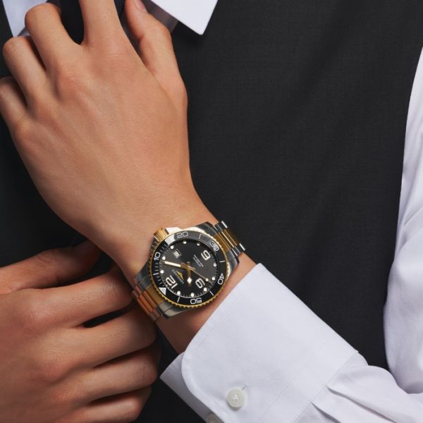 Montre Hydroconquest Cadran Noir soleillé Bracelet Acier et PVD jaune
