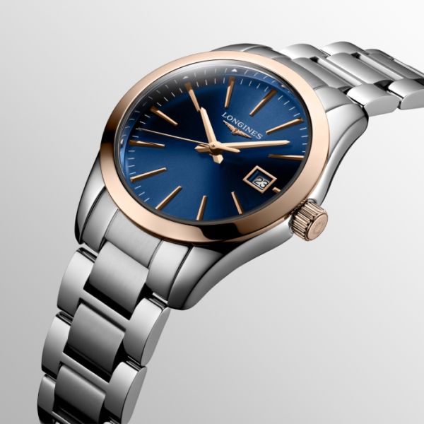 Montre Conquest Classic Cadran Bleu Bracelet Acier PVD rouge