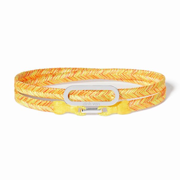 Bracelet Dinh Van sur cordon jaune tonic Maillon L or blanc
