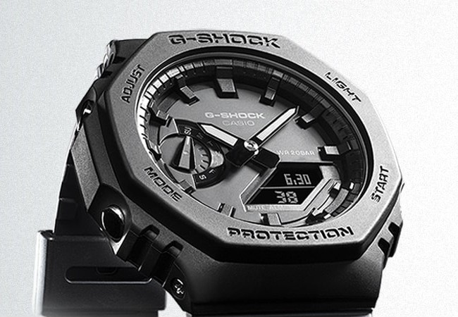 Casio G-Shock GA-2100 de 2019, lunette octogonale noire marquée PROTECTION, aiguilles et petit écran digital, visuel officiel Casio