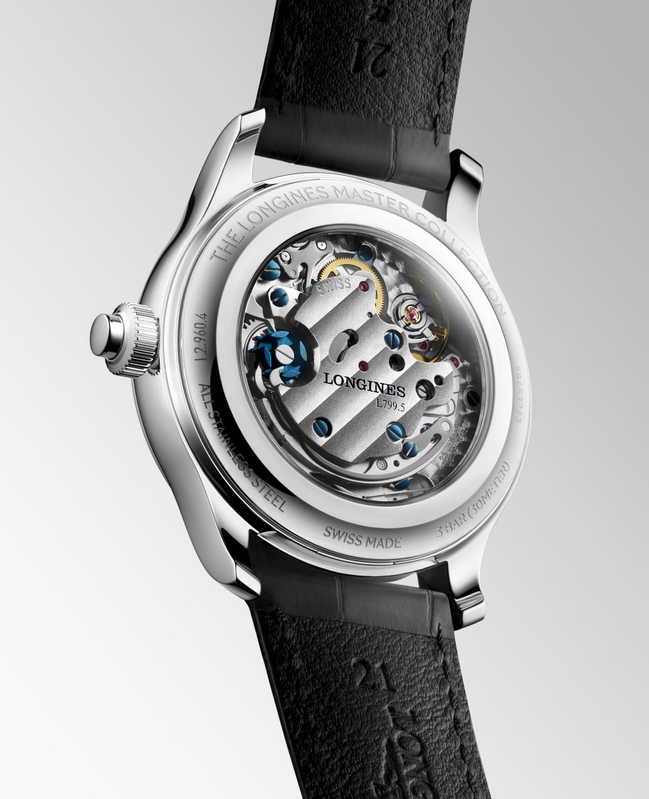 Calibre Longines L799.5 à remontage manuel vu sous le fond saphir, roue à colonnes bleuie et côtes de Genève