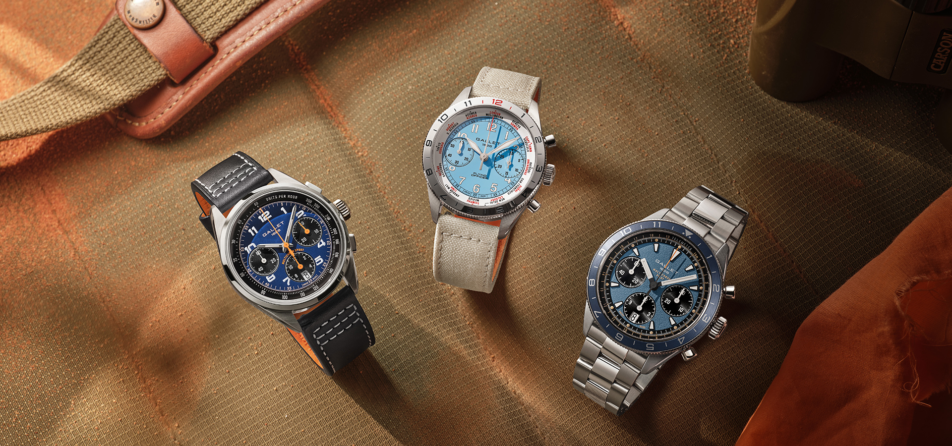 Trois chronographes Gallet 2026 posés sur une toile, Flying Officer, Multichron Sport et Multichron Pilot